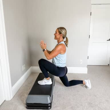 Chris Freytag performing a lunge exercise on a step platform