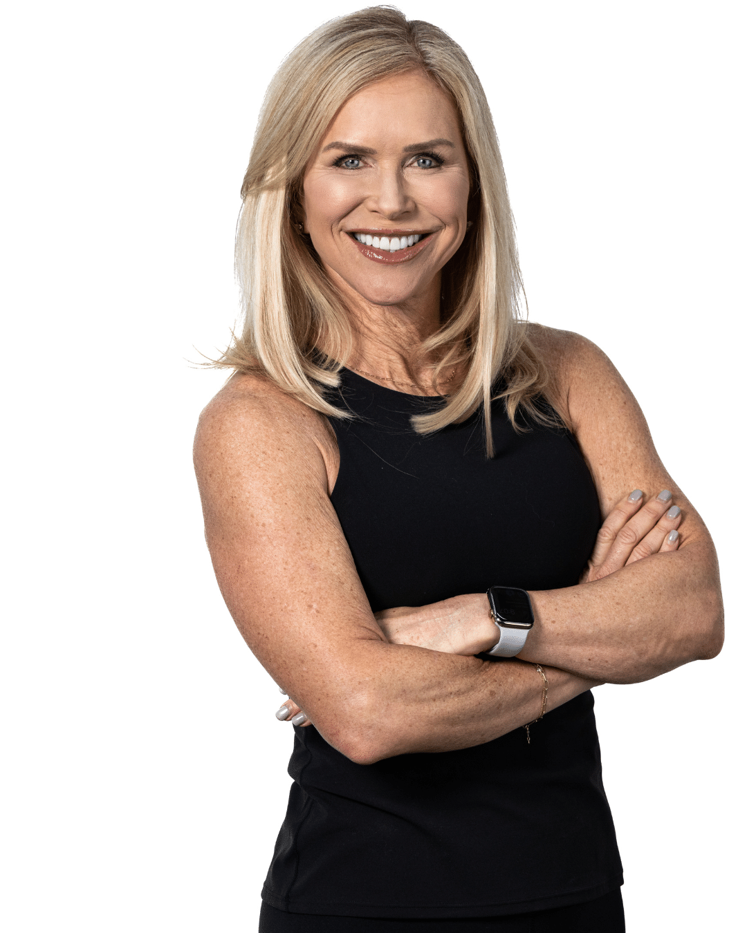 Chris Freytag wearing black tank top, crossing her arms for a fitness photo shoot.