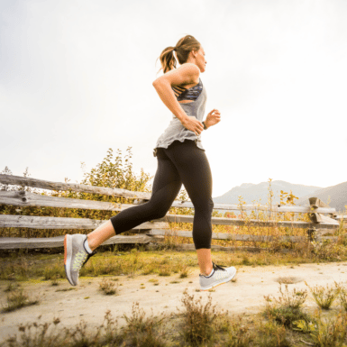 woman running outside on trail