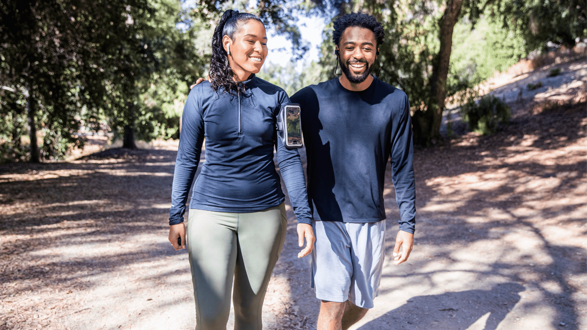 fit couple walking outside